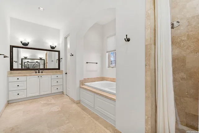 a bathroom with a bathtub and a sink