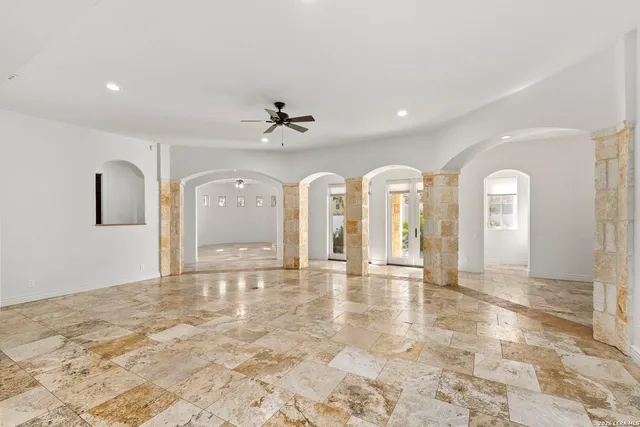 a view of livingroom with fireplace and fan
