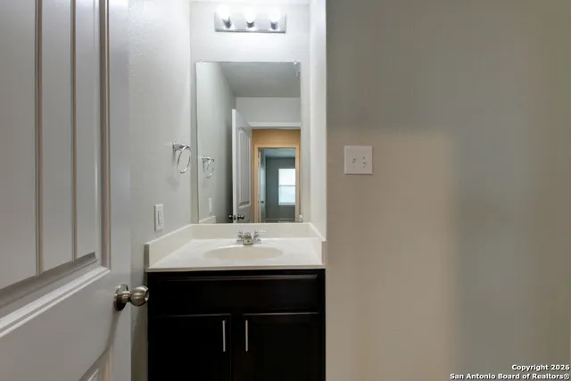 a bathroom with a sink a toilet and bathtub