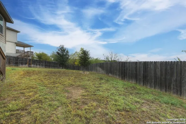 a view of a city and lush green forest