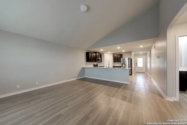 a view of a kitchen with a sink and a microwave