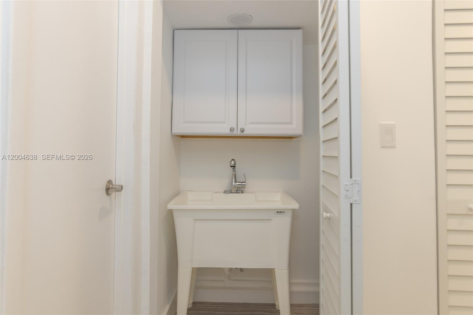 1690 Daytonia Road Miami Beach, FL 33141 - Photo 81 of 88 a bathroom with a sink a vanity and a mirror