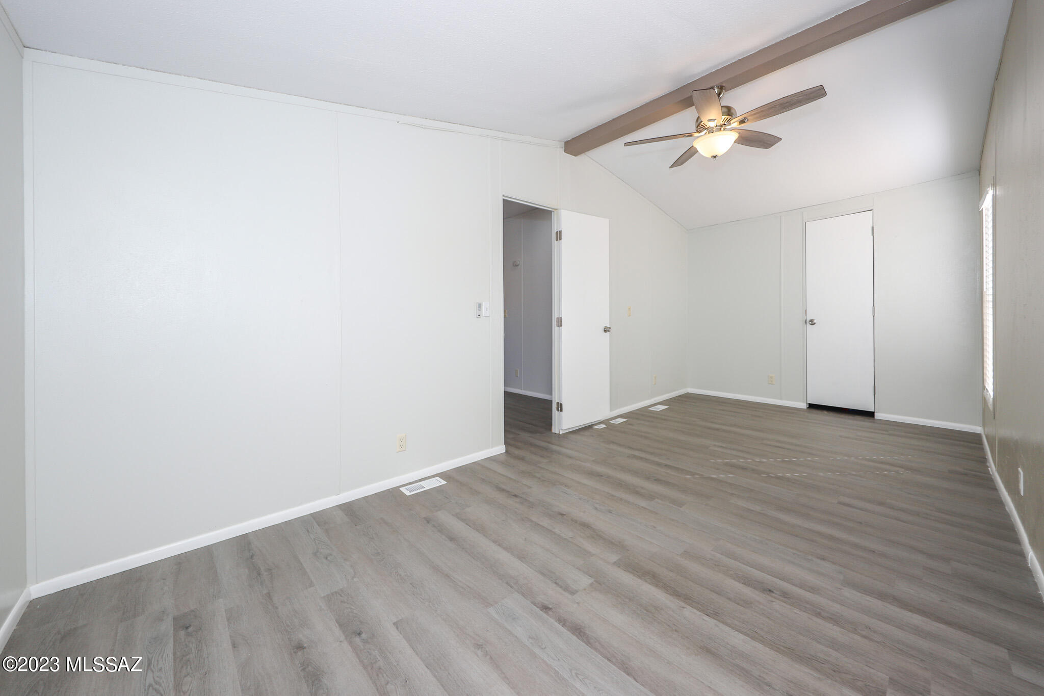 55 East King Road Tucson, AZ 85705 - Photo 23 of 26 a view of an empty room with wooden floor