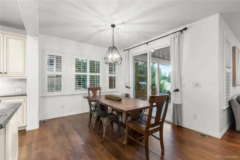 a dining room with furniture window wooden floor