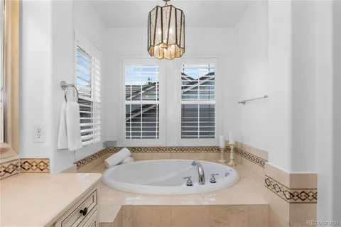 a bathroom with a bathtub and a window