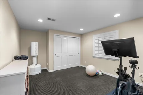 a room with a window and gym equipment