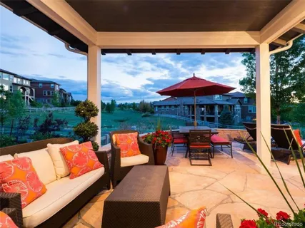 a view of patio with chairs and tables
