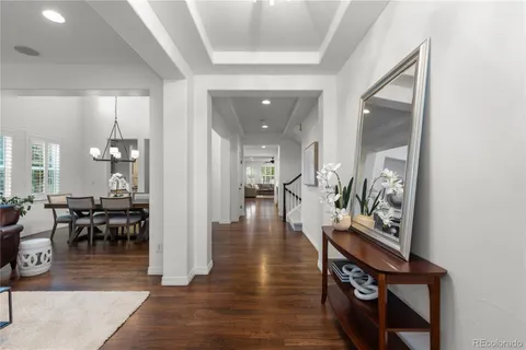 wooden floor with dining room and livingroom view