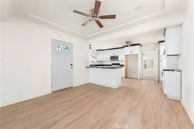 a view of kitchen with wooden floor