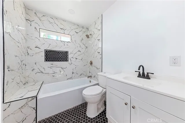 a bathroom with a bathtub and sink
