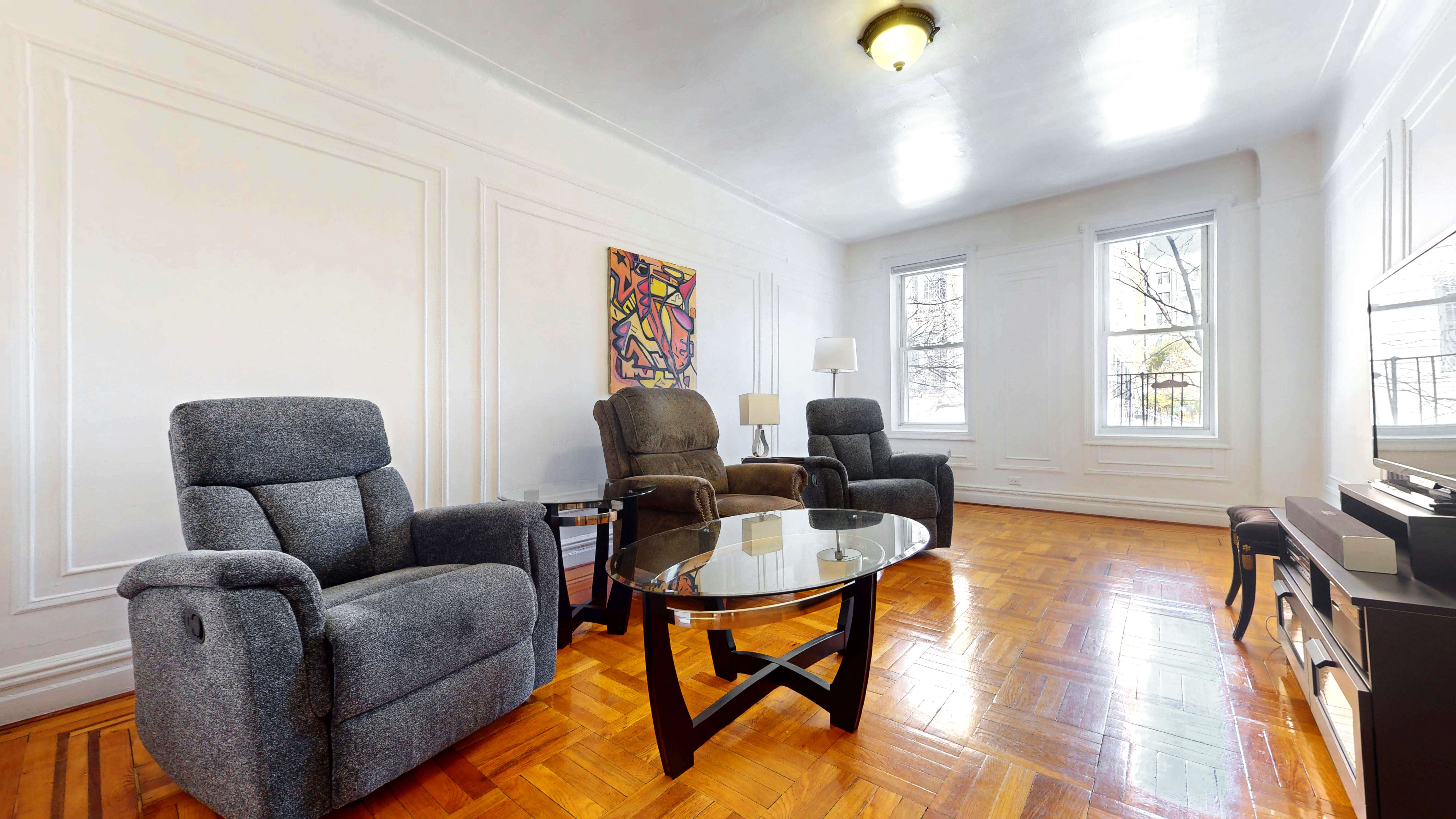 2081 Cruger Avenue, Unit 2K Bronx, NY 10462 - Photo 5 of 12 a living room with furniture and a window