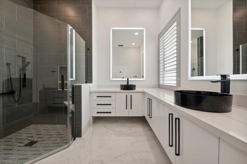 23337 Torre Circle Boca Raton, FL 33433 - Photo 13 of 20 a kitchen with granite countertop a sink and cabinets