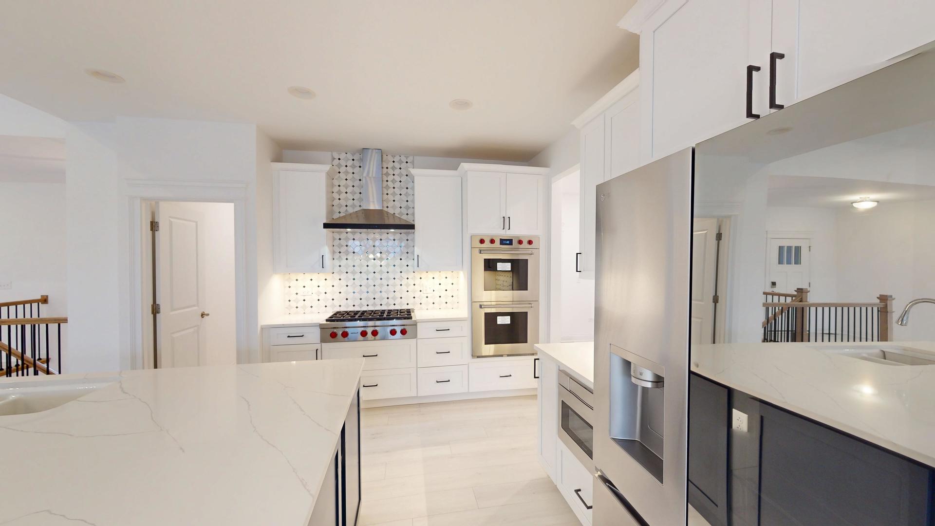 1S980 Deerpath Road Batavia, IL 60510 - Photo 11 of 43 a large white kitchen with stainless steel appliances