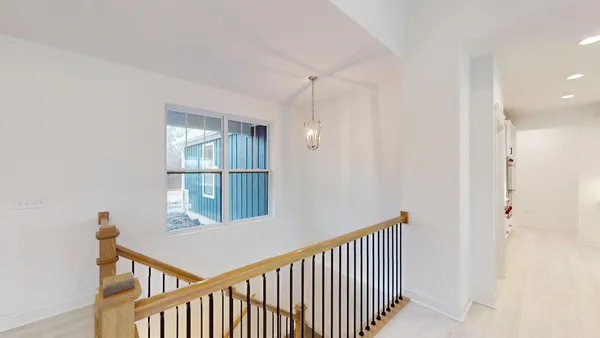 a view of a hallway with windows
