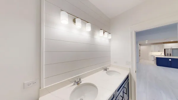 a bathroom with a sink and mirror