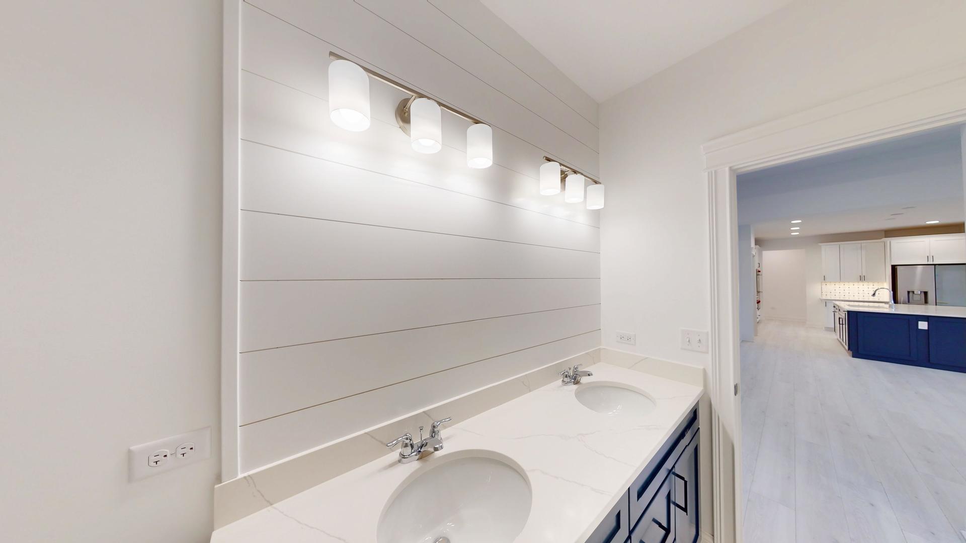 1S980 Deerpath Road Batavia, IL 60510 - Photo 15 of 43 a bathroom with a sink and mirror