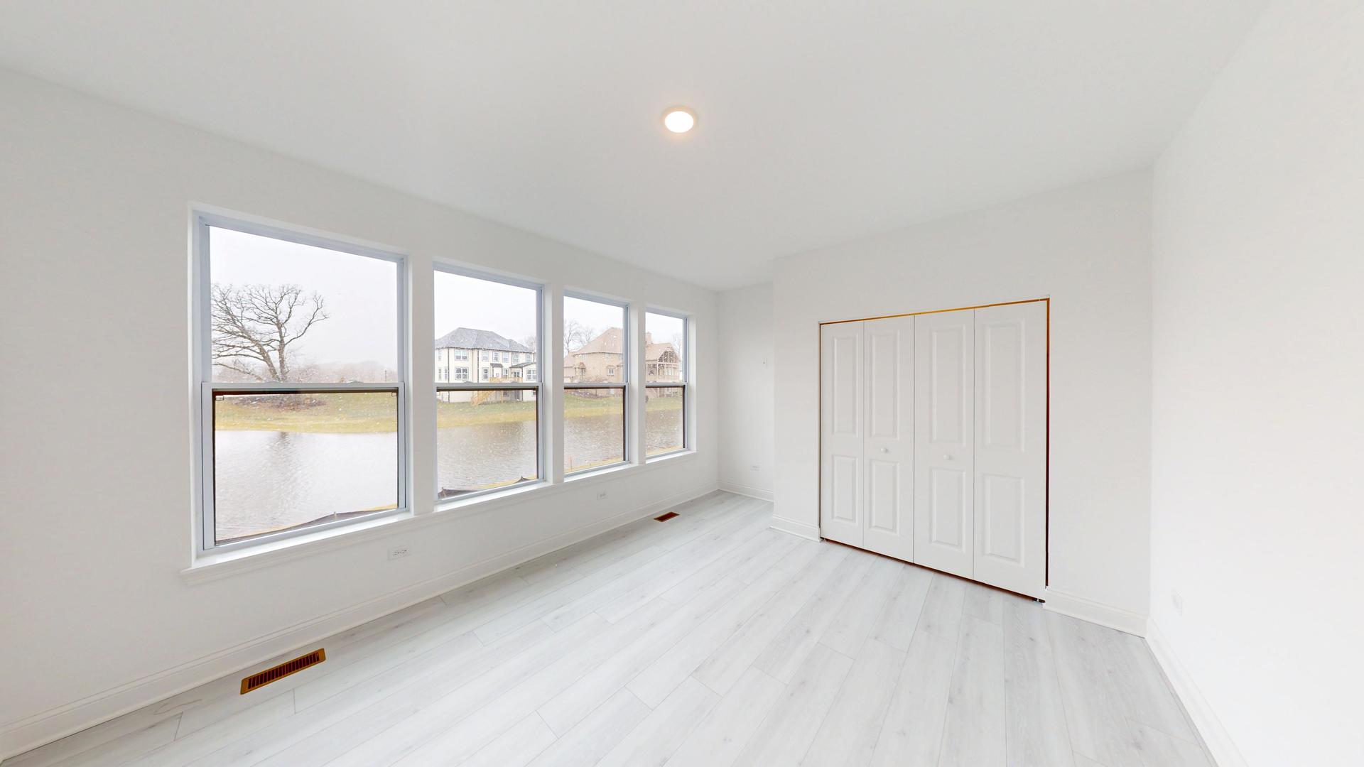 1S980 Deerpath Road Batavia, IL 60510 - Photo 16 of 43 an empty room with windows and city view