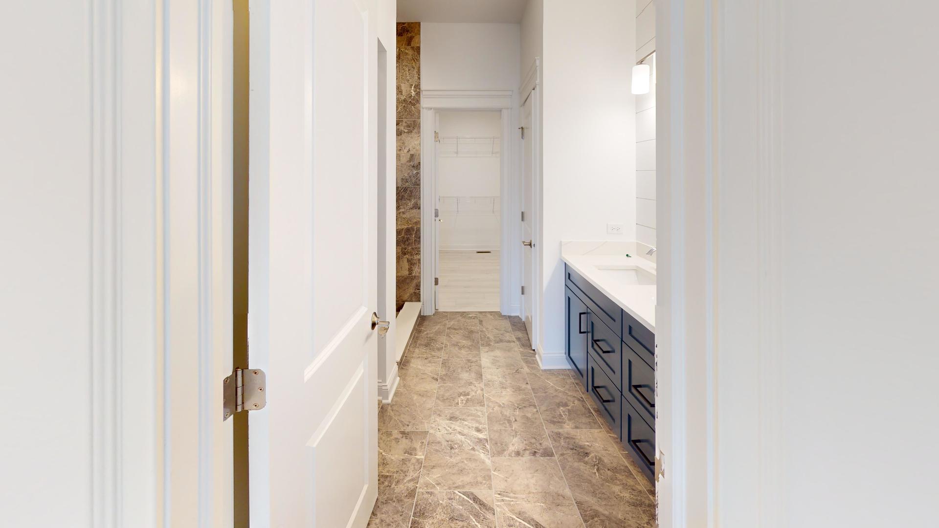 1S980 Deerpath Road Batavia, IL 60510 - Photo 27 of 43 a spacious bathroom with a bathtub and shower
