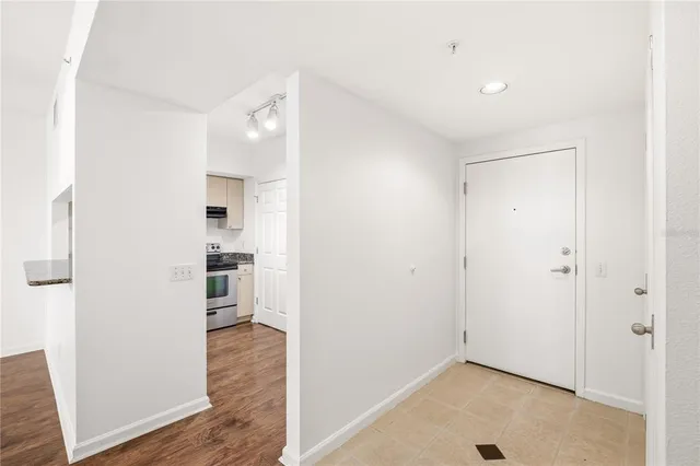 a view of a kitchen with wooden floor