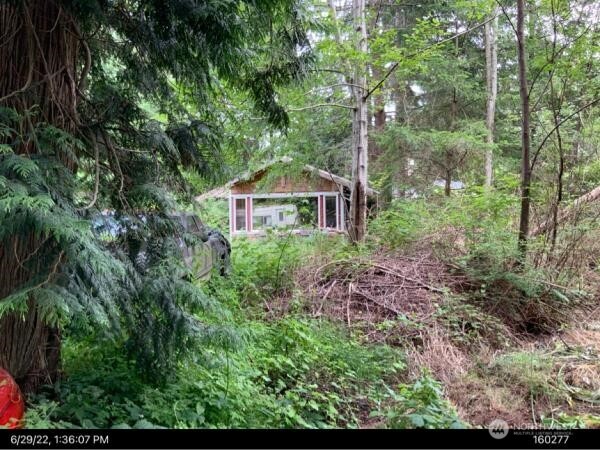 2 Kennedy Road Point Roberts, WA 98281 - Photo 1 of 1 a view of a garden with a house in the background