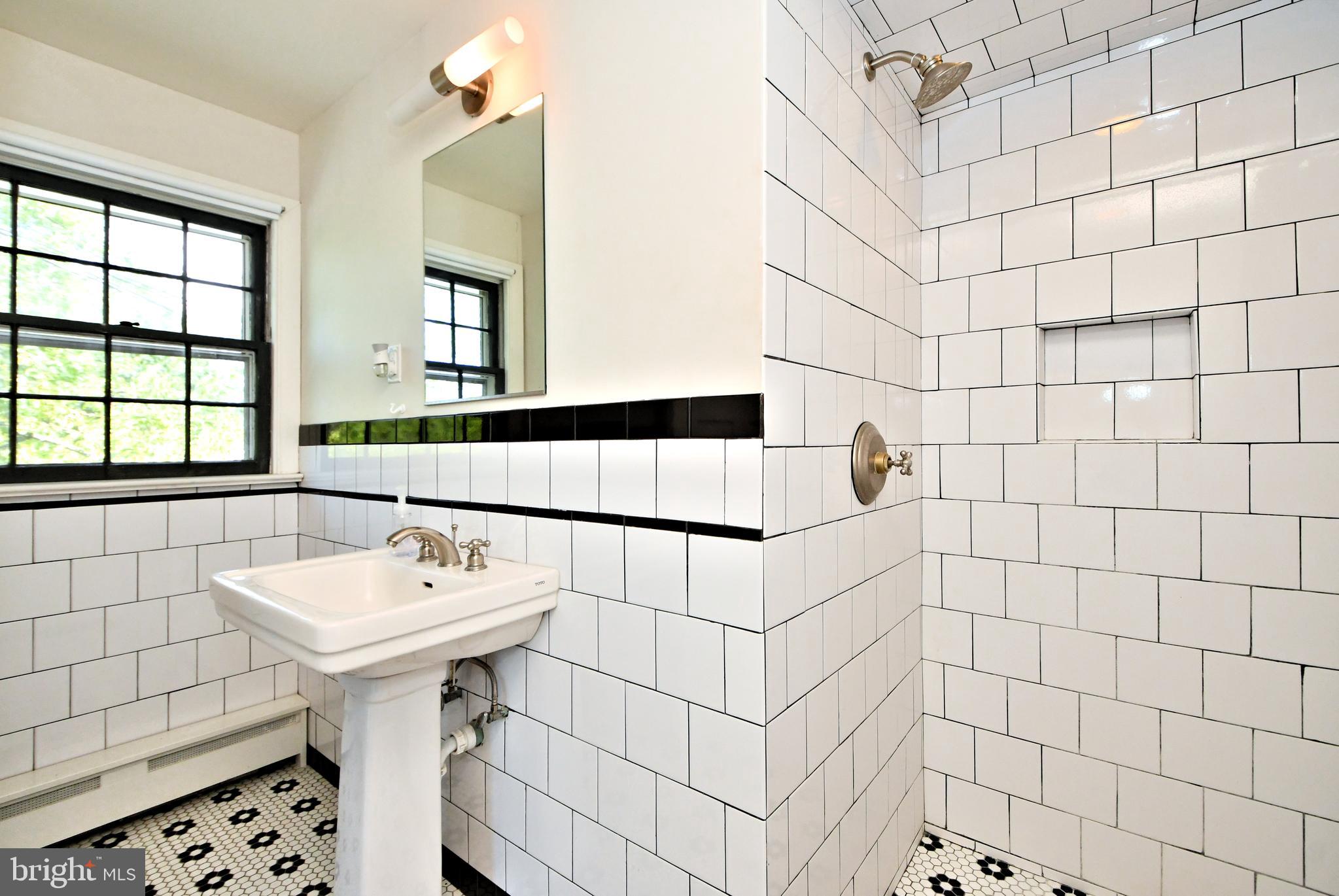 143 Old York Road New Hope, PA 18938 - Photo 29 of 70 a bathroom with a sink a toilet and shower curtain