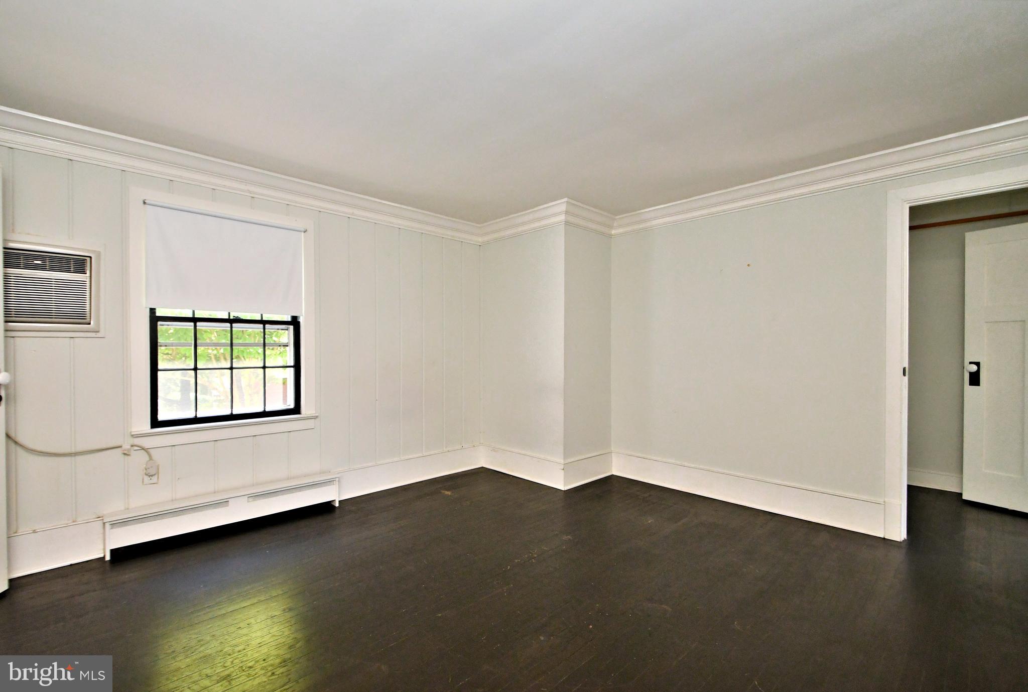 143 Old York Road New Hope, PA 18938 - Photo 31 of 70 a view of an empty room with wooden floor and a window