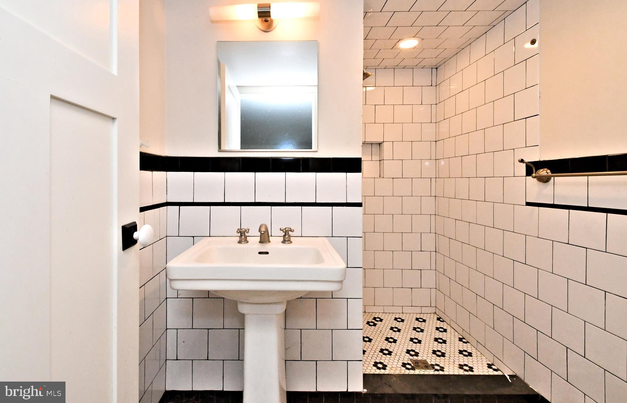 143 Old York Road New Hope, PA 18938 - Photo 52 of 70 a bathroom with a sink a toilet and a mirror