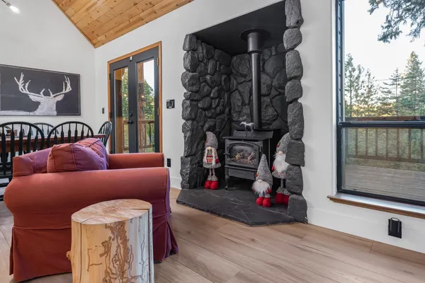 a dining room with furniture and wooden floor