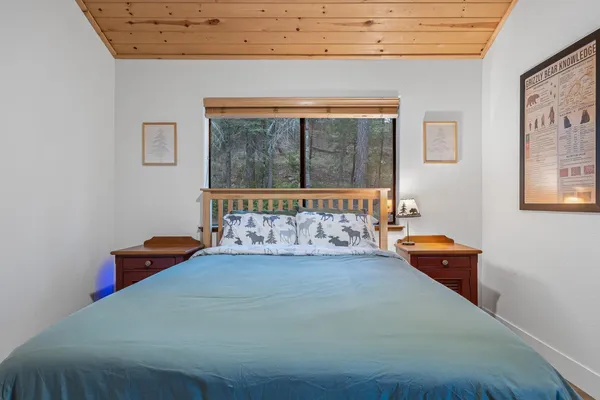 a room with pool table and windows