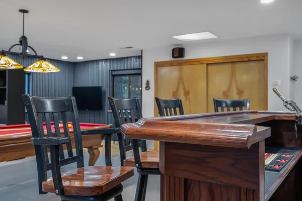 a dining room with furniture and window