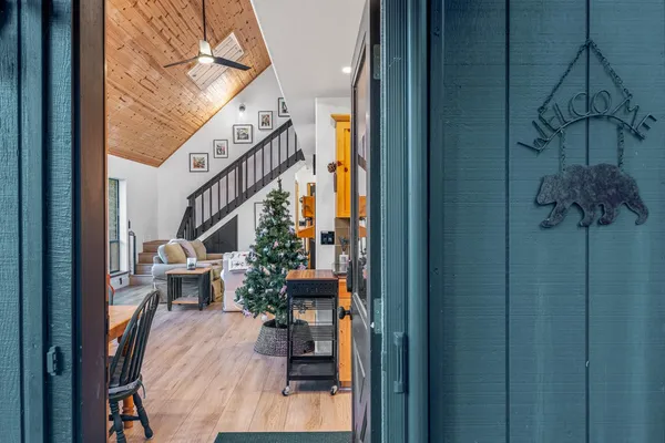 a view of entryway dining room and hall with wooden floor
