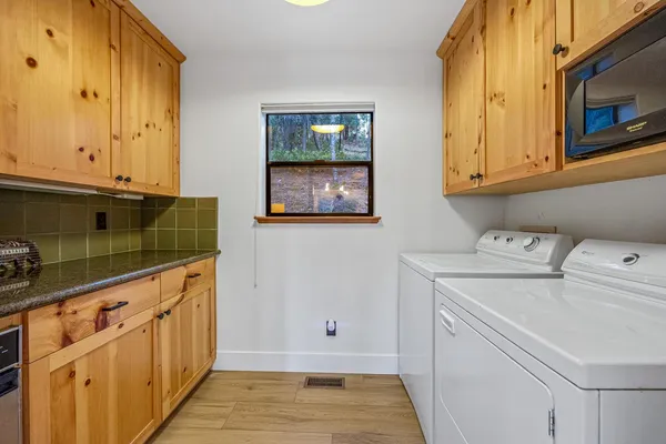 a kitchen with stainless steel appliances granite countertop a sink and cabinets