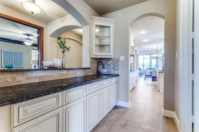 a view of a bathroom with sink and mirror