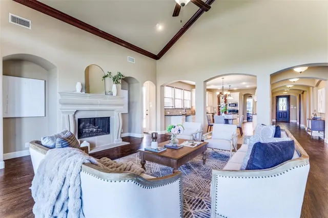 a living room with fireplace furniture and a fireplace