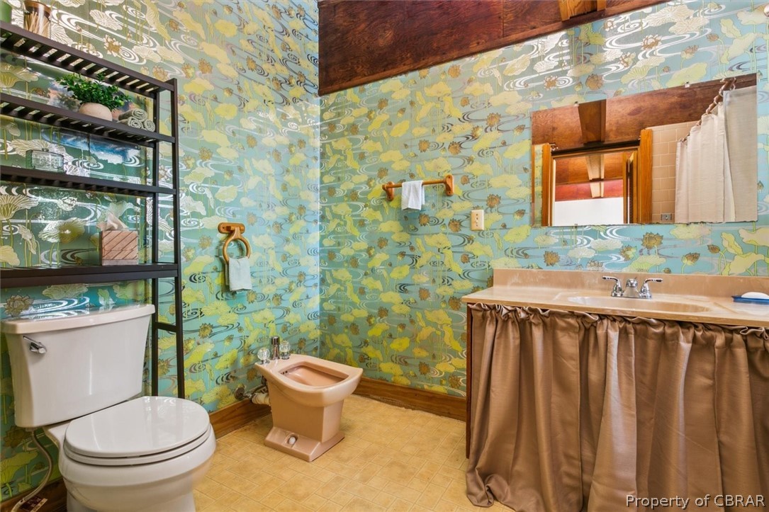 4544 Piney Swamp Road Hayes, VA 23072 - Photo 21 of 48 Bathroom with sink, tile floors, a bidet, and toilet