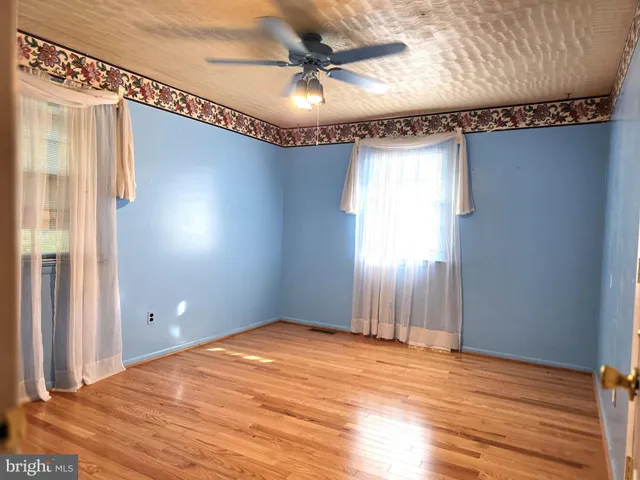 a bedroom with a bed and a chair