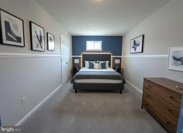 a view of empty room with wooden floor and fireplace