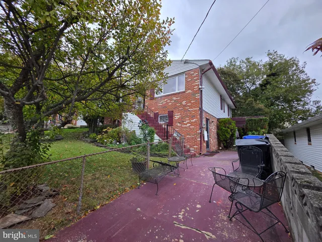 a view of backyard with a garden and entertaining space