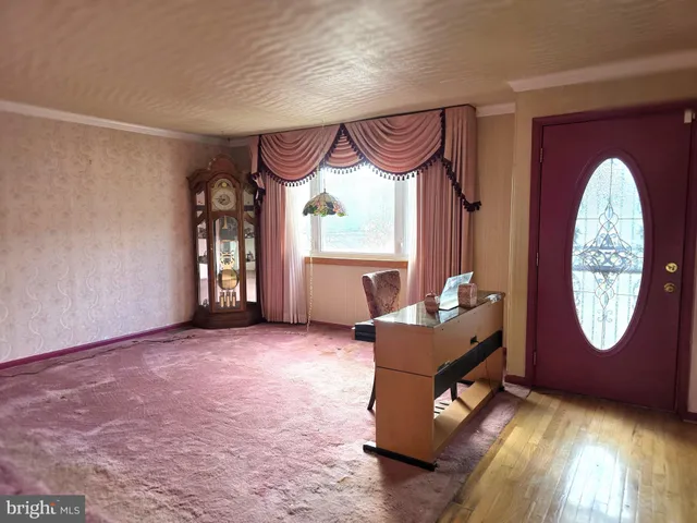 a living room with furniture a table and a window