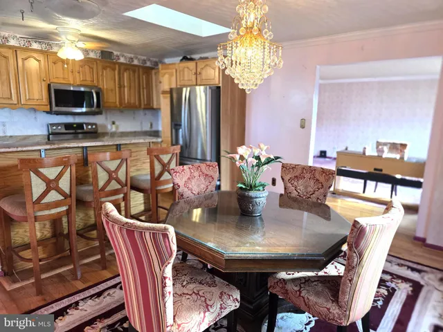 a kitchen with sink stove and cabinets