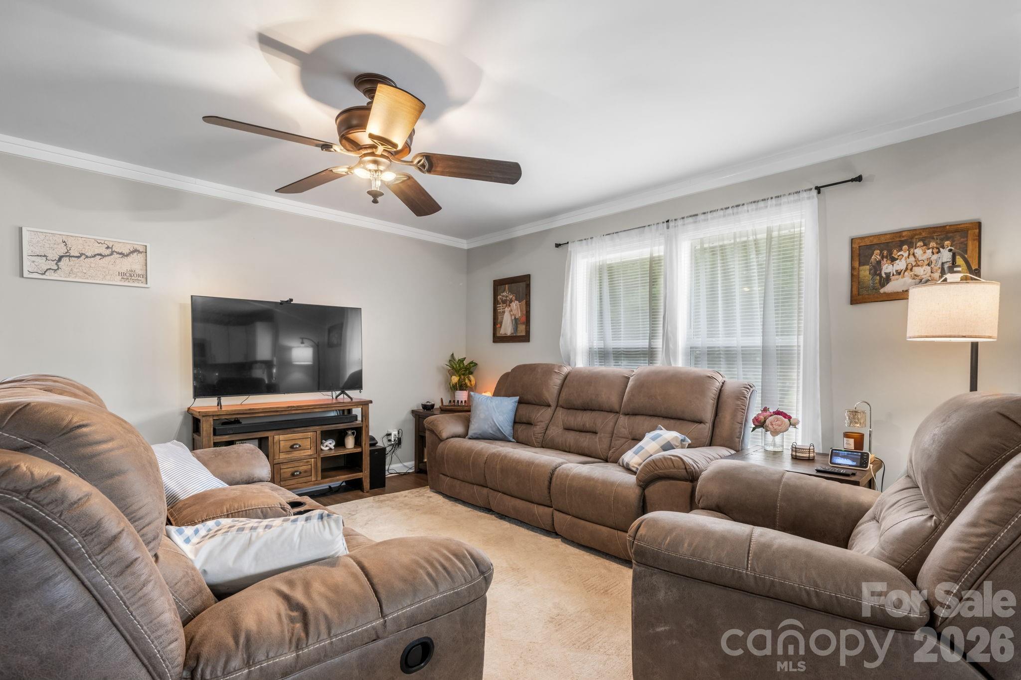 3941 Springs Road Northeast Conover, NC 28613 - Photo 7 of 21 a living room with furniture and a flat screen tv