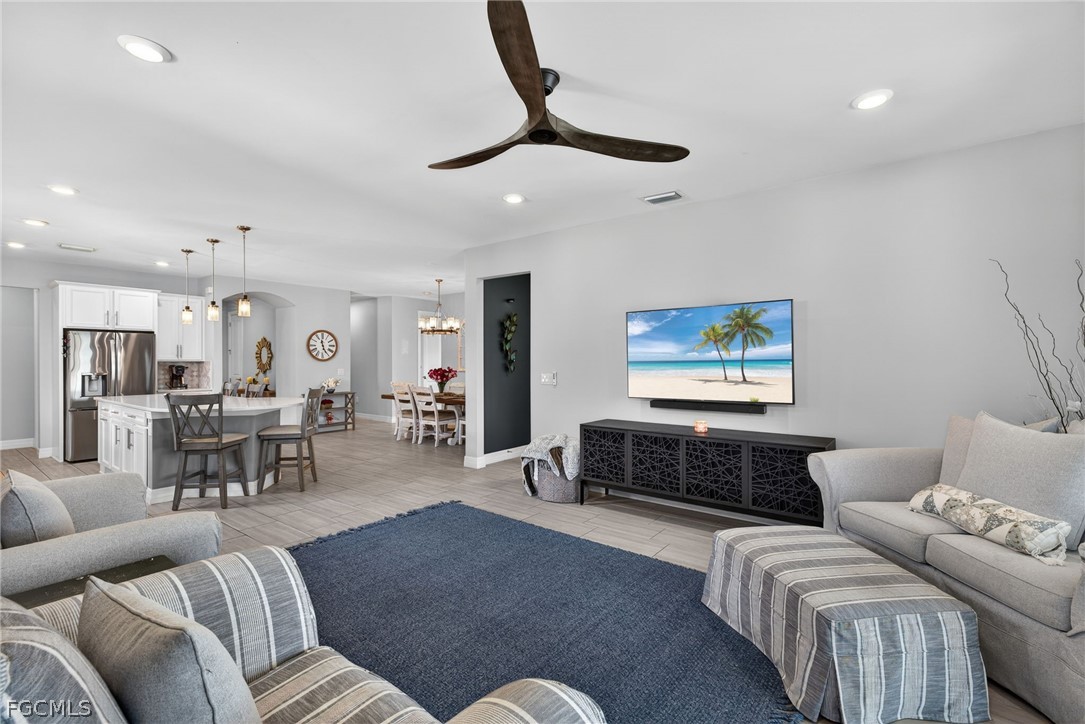 11914 Bourke Place Fort Myers, FL 33913 - Photo 14 of 49 a living room with furniture and a flat screen tv