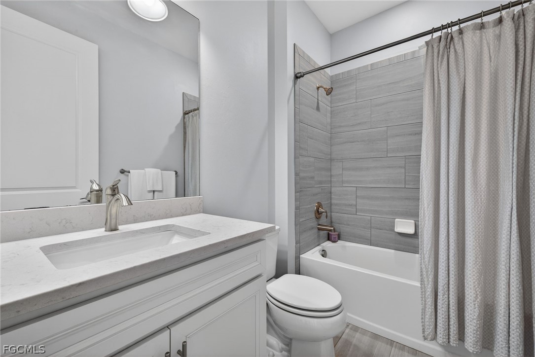 11914 Bourke Place Fort Myers, FL 33913 - Photo 24 of 49 a bathroom with a sink toilet and shower