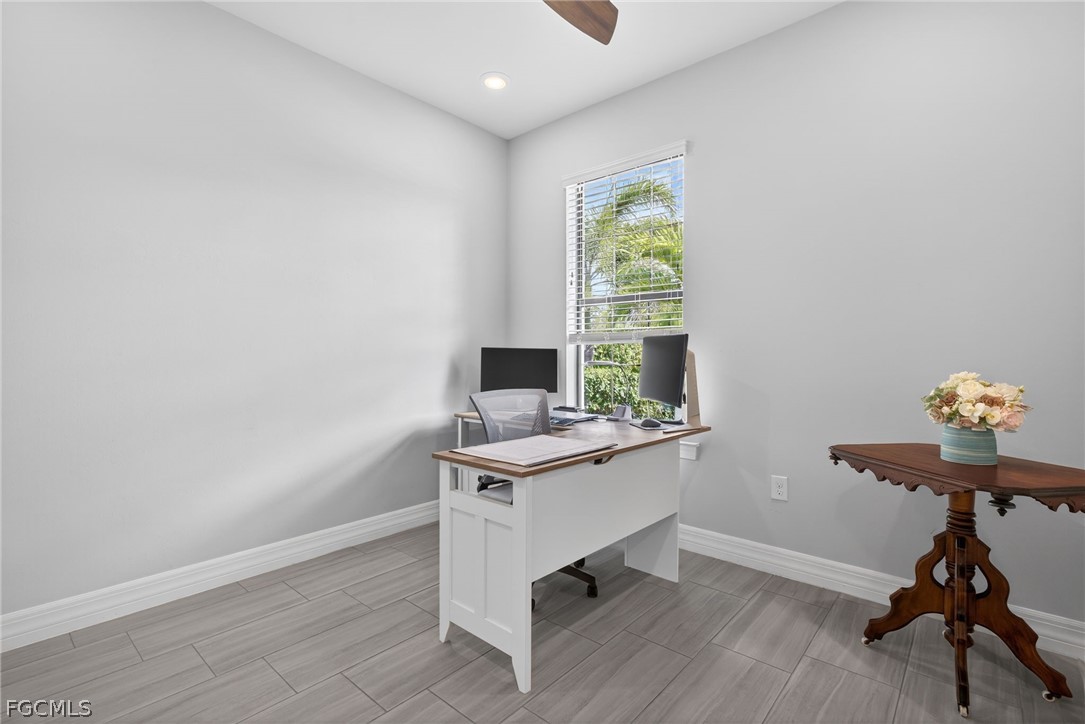 11914 Bourke Place Fort Myers, FL 33913 - Photo 26 of 49 a view of a workspace with furniture and a window