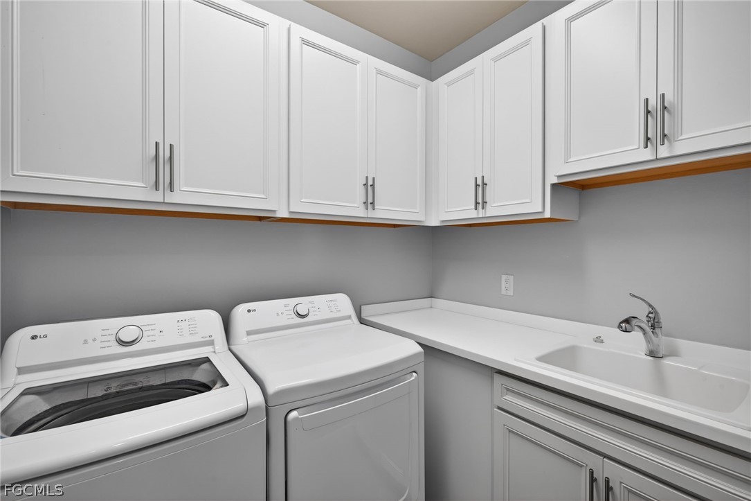11914 Bourke Place Fort Myers, FL 33913 - Photo 27 of 49 a utility room with dryer and washer