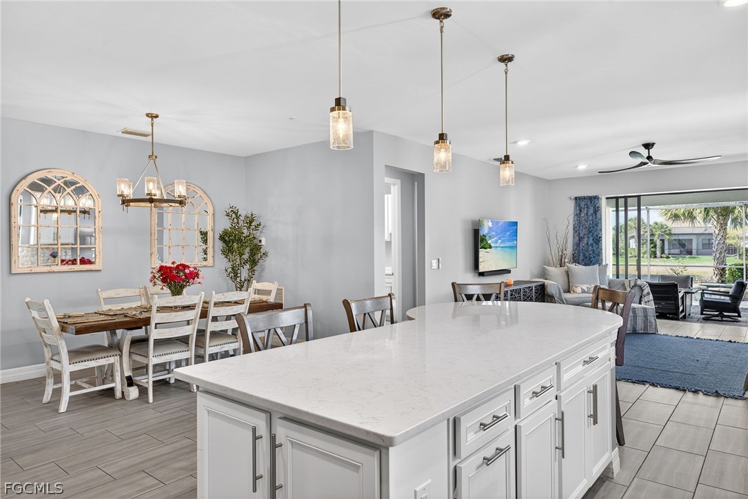 11914 Bourke Place Fort Myers, FL 33913 - Photo 8 of 49 a large kitchen with a table and chairs