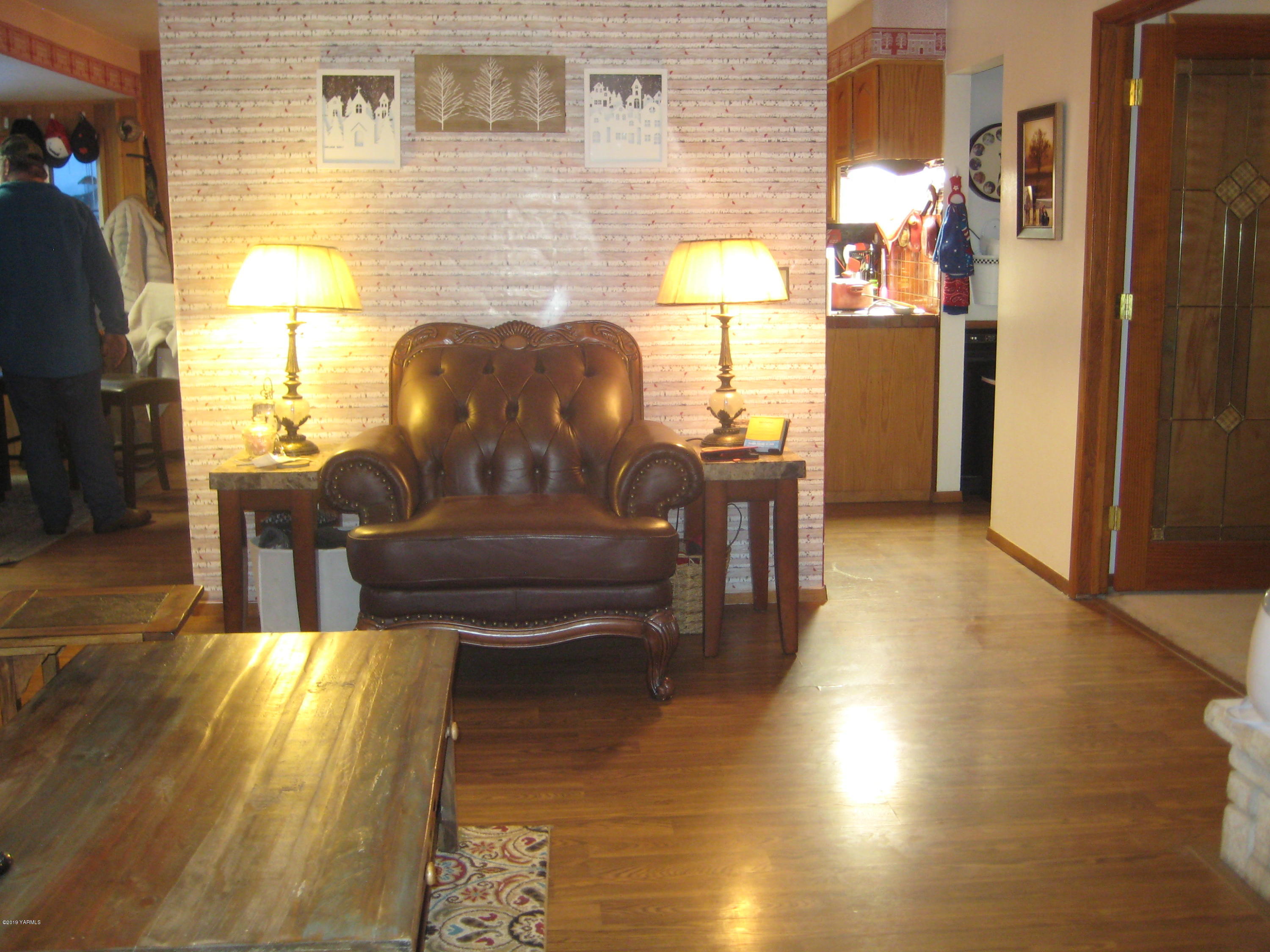 5900 Ashue Road Wapato, WA 98951 - Photo 13 of 60 a living room with furniture and a fireplace