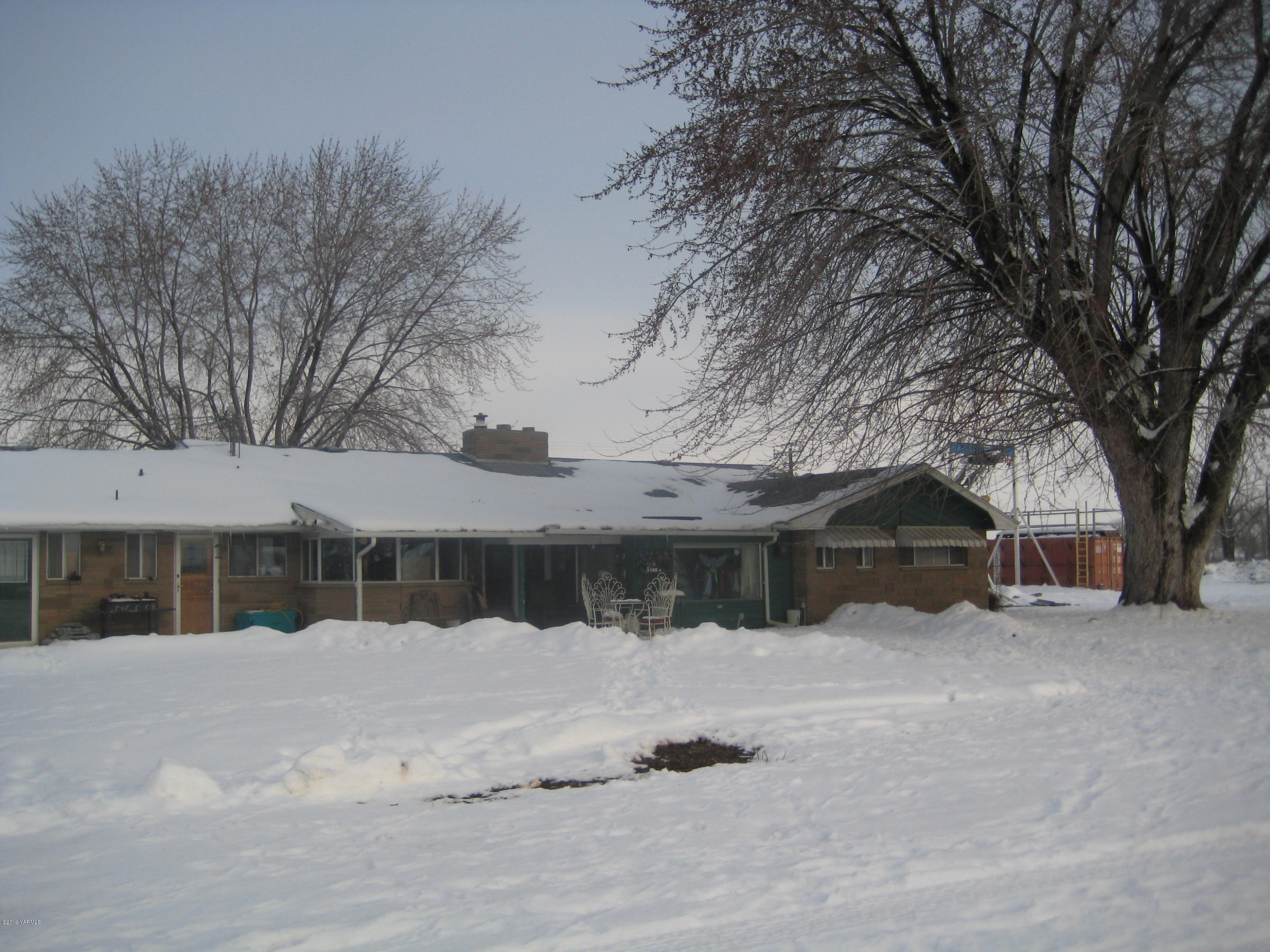 5900 Ashue Road Wapato, WA 98951 - Photo 3 of 60 a view of a house with a snow in the yard