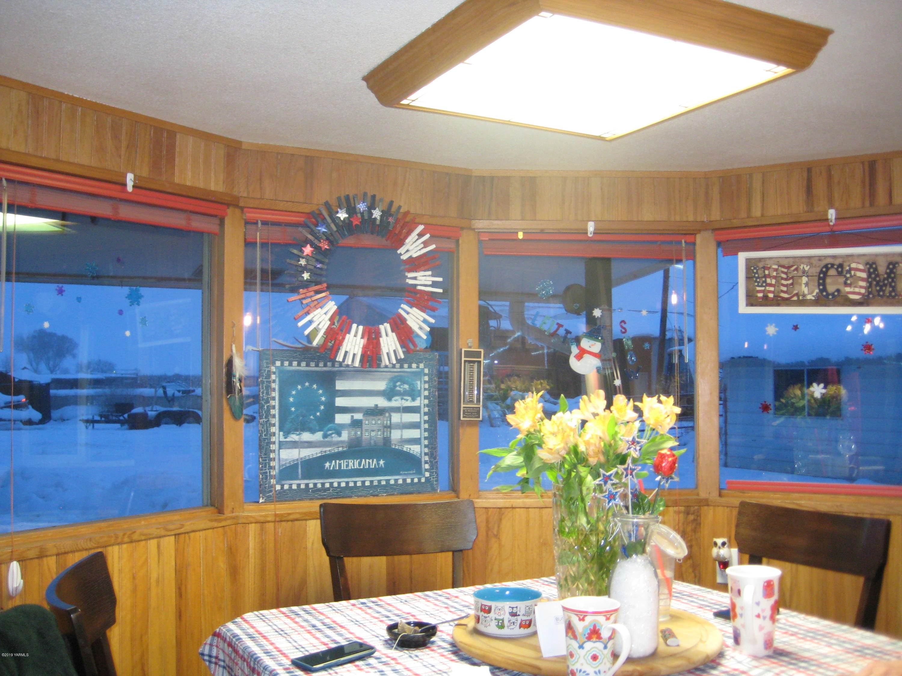 5900 Ashue Road Wapato, WA 98951 - Photo 28 of 60 a view of a dining room with furniture and chandelier