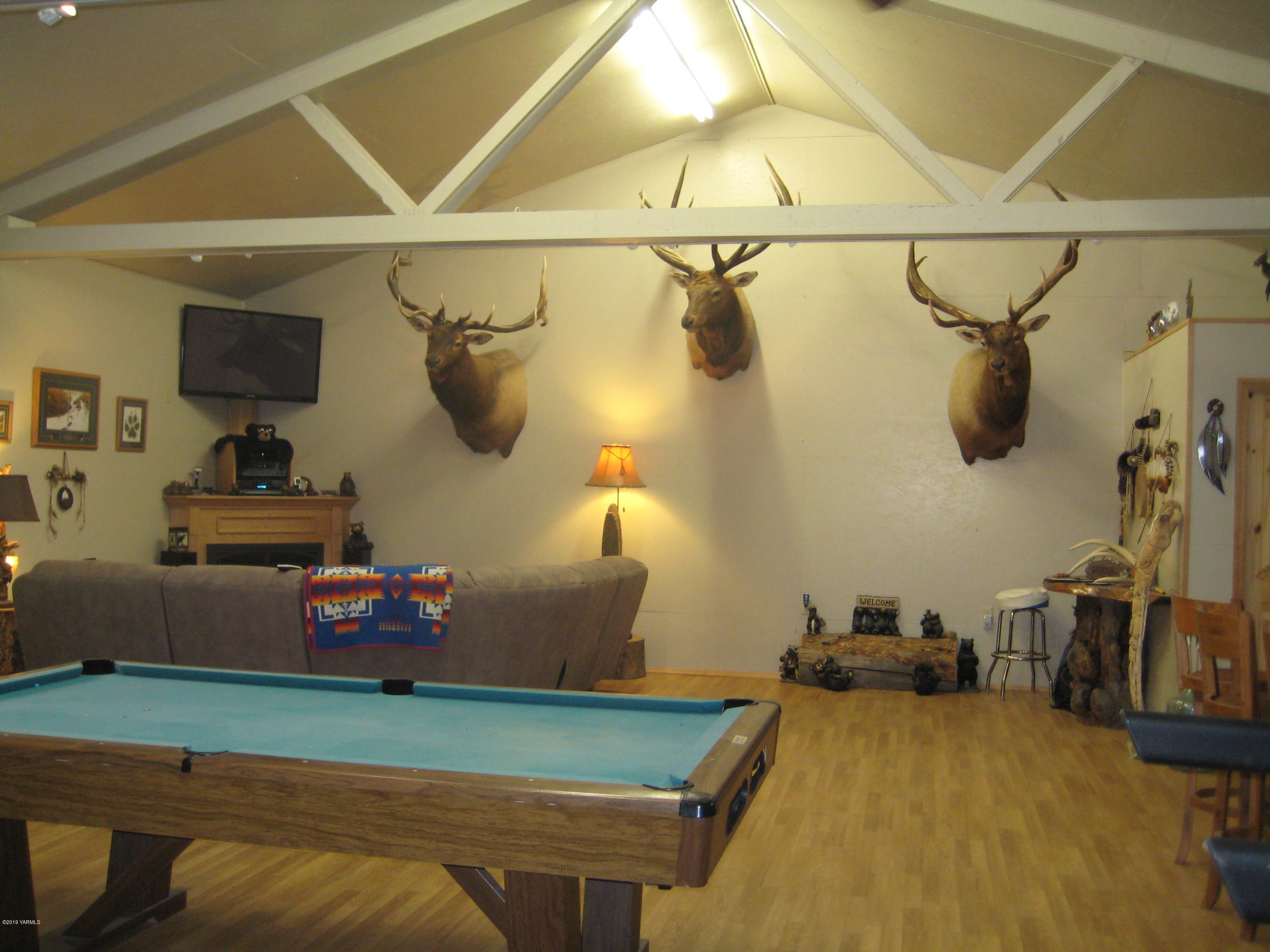 5900 Ashue Road Wapato, WA 98951 - Photo 48 of 60 a room with lots of stuff and hardwood floor